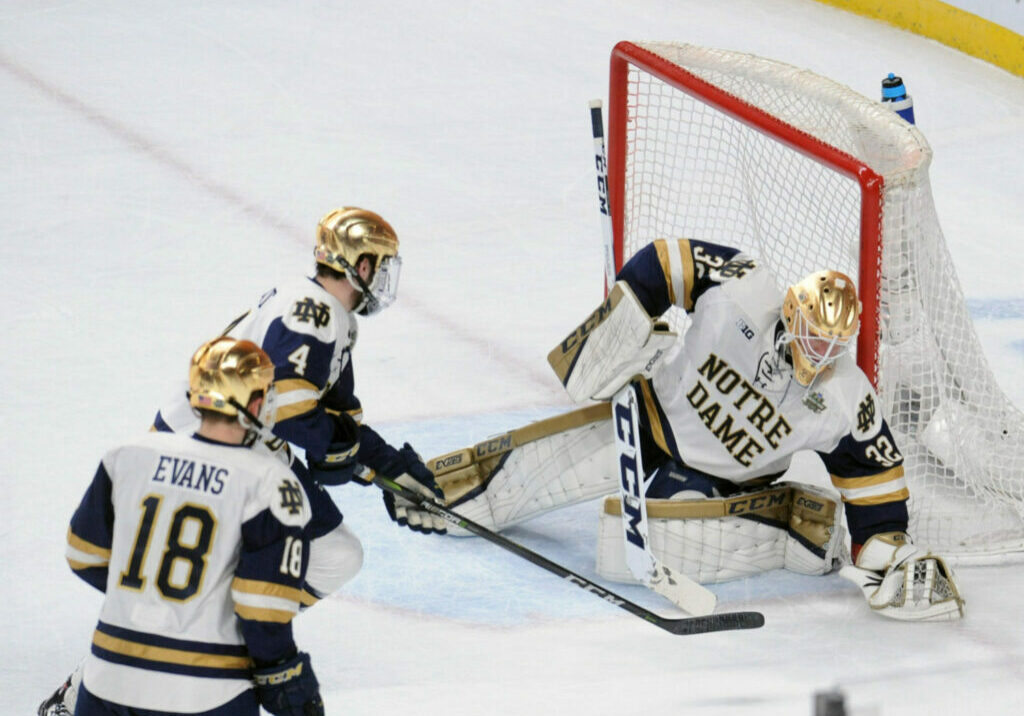 Apr 7, 2018; St. Paul, MN, USA;  Notre Dame goalie Cale Morris (32) makes a covering save during the first period against the Minnesota Duluth Bulldogs in the 2018 Frozen Four college hockey national championship game at Xcel Energy Center. Mandatory Credit: Marilyn Indahl-USA TODAY Sports